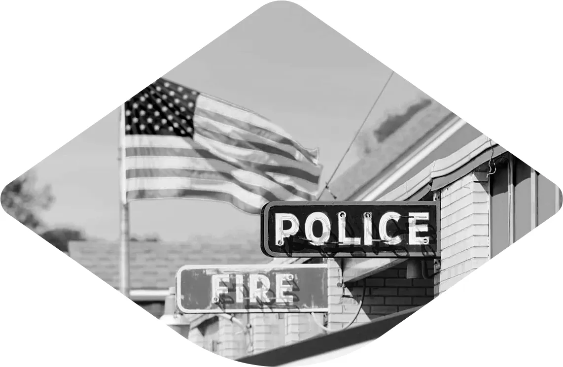 Police and fire stations in front of an American flag