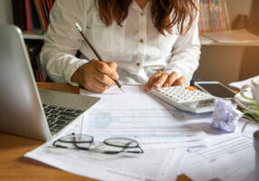 Budget planning concept,Accountant is calculating company's annual tax.Calendar 2019 and personal income tax forms for those who have income under US law placed on office desk.This is the season to pay taxes.