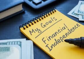 Notebook with written inscription my goals financial independence.